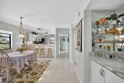 a very nice looking room with a dining table chairs