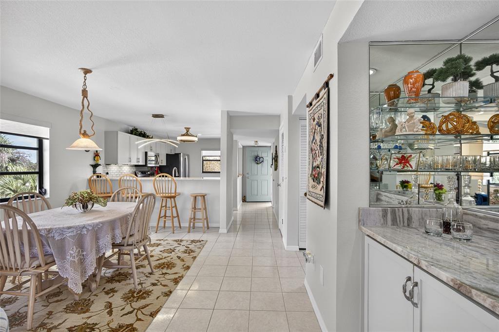 175 Kings Highway, Unit 738 Punta Gorda, FL 33983 - Photo 11 of 36 a very nice looking room with a dining table chairs