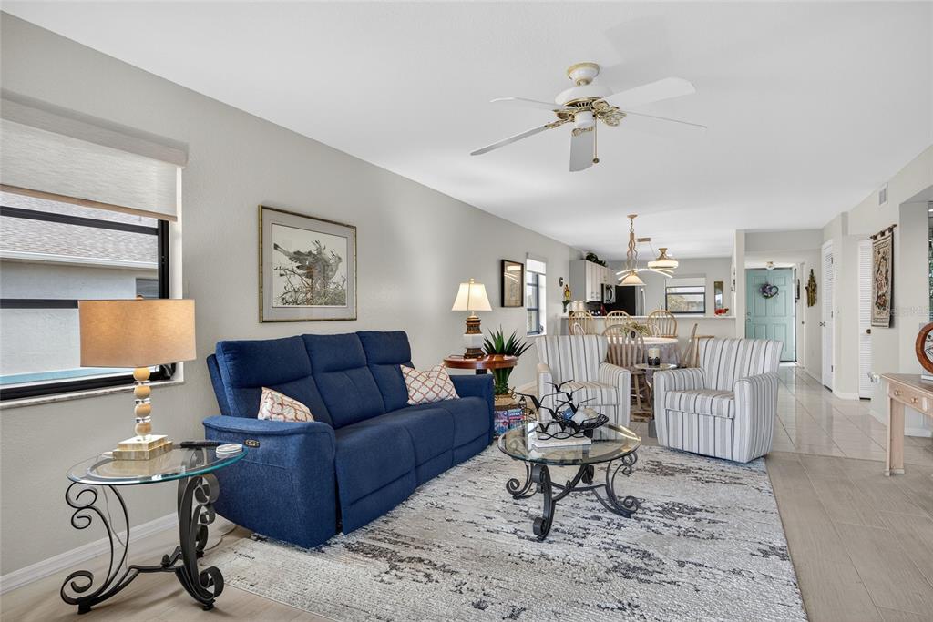 175 Kings Highway, Unit 738 Punta Gorda, FL 33983 - Photo 16 of 36 a living room with furniture and a chandelier