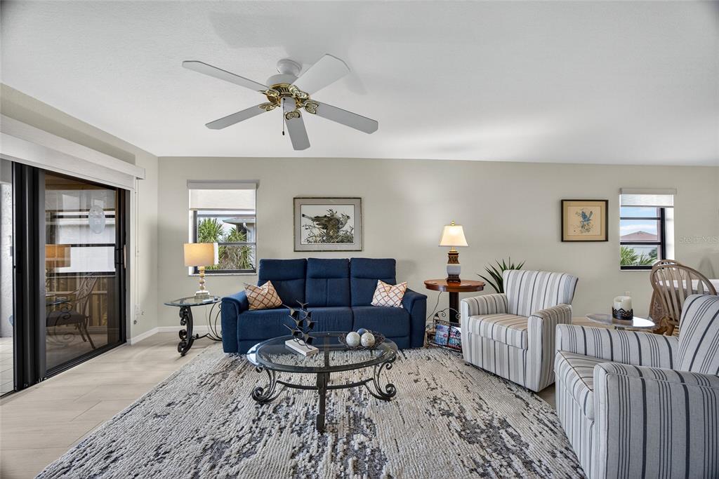 175 Kings Highway, Unit 738 Punta Gorda, FL 33983 - Photo 17 of 36 a living room with furniture and a wooden floor