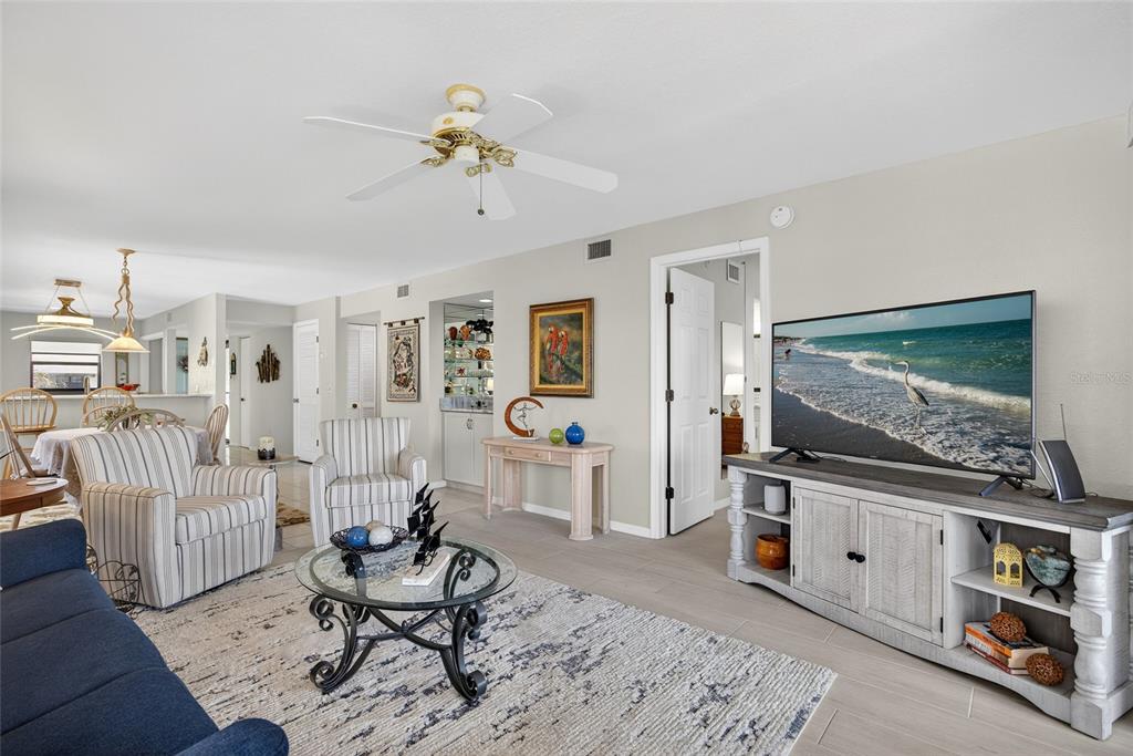 175 Kings Highway, Unit 738 Punta Gorda, FL 33983 - Photo 18 of 36 a living room with furniture and a flat screen tv
