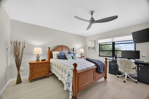 a bed room with a bed and a tv