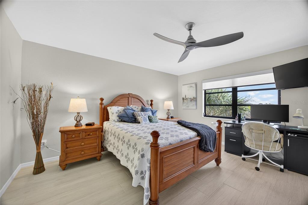 175 Kings Highway, Unit 738 Punta Gorda, FL 33983 - Photo 19 of 36 a bed room with a bed and a tv