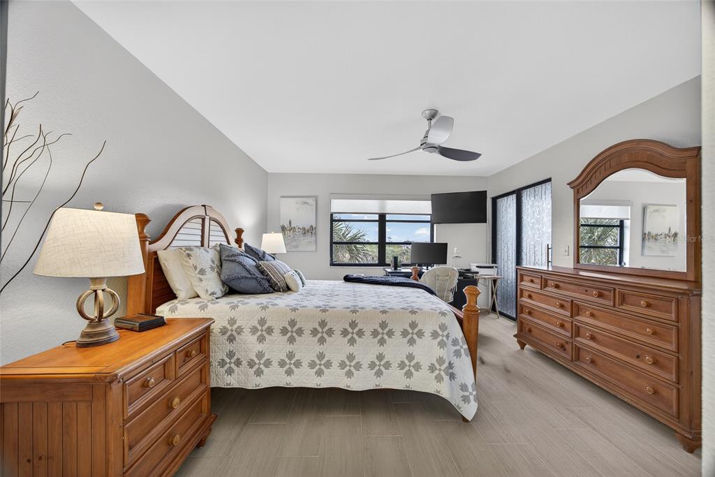 175 Kings Highway, Unit 738 Punta Gorda, FL 33983 - Photo 20 of 36 a bedroom with a bed a dresser and window