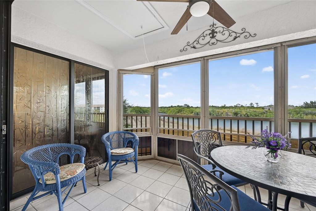 175 Kings Highway, Unit 738 Punta Gorda, FL 33983 - Photo 24 of 36 a balcony with furniture and a large window