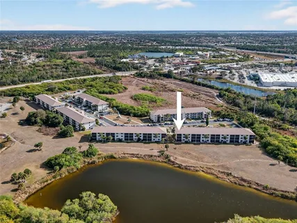 an aerial view of a city with lake