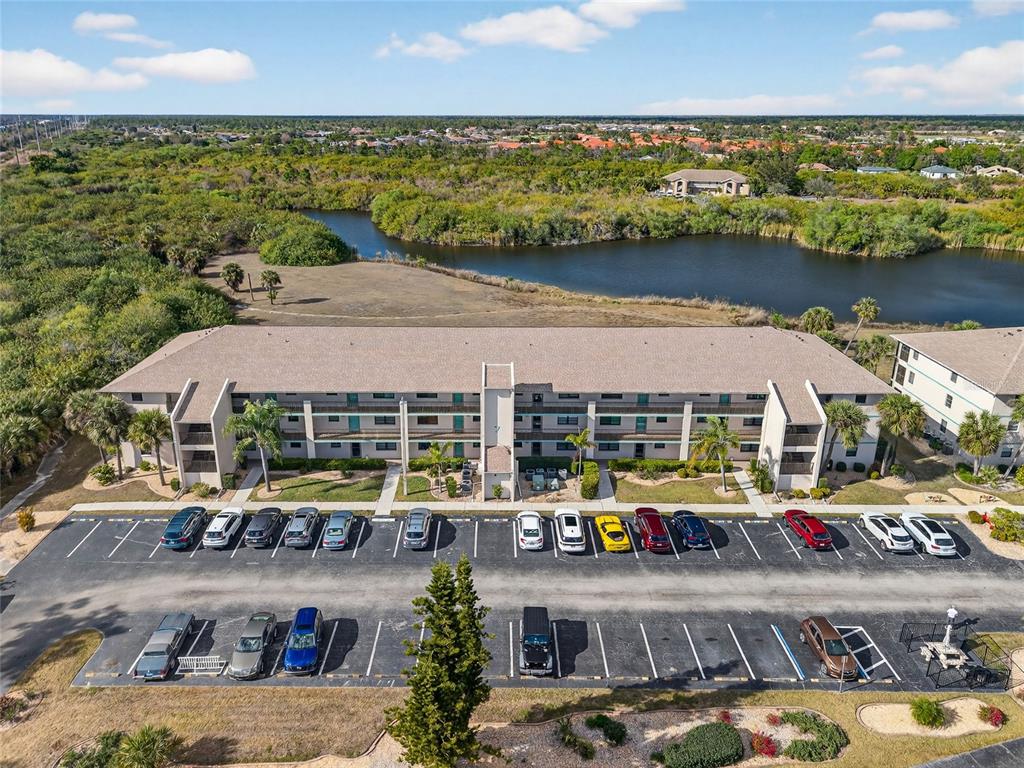 175 Kings Highway, Unit 738 Punta Gorda, FL 33983 - Photo 27 of 36 a view of swimming pool with outdoor seating and yard