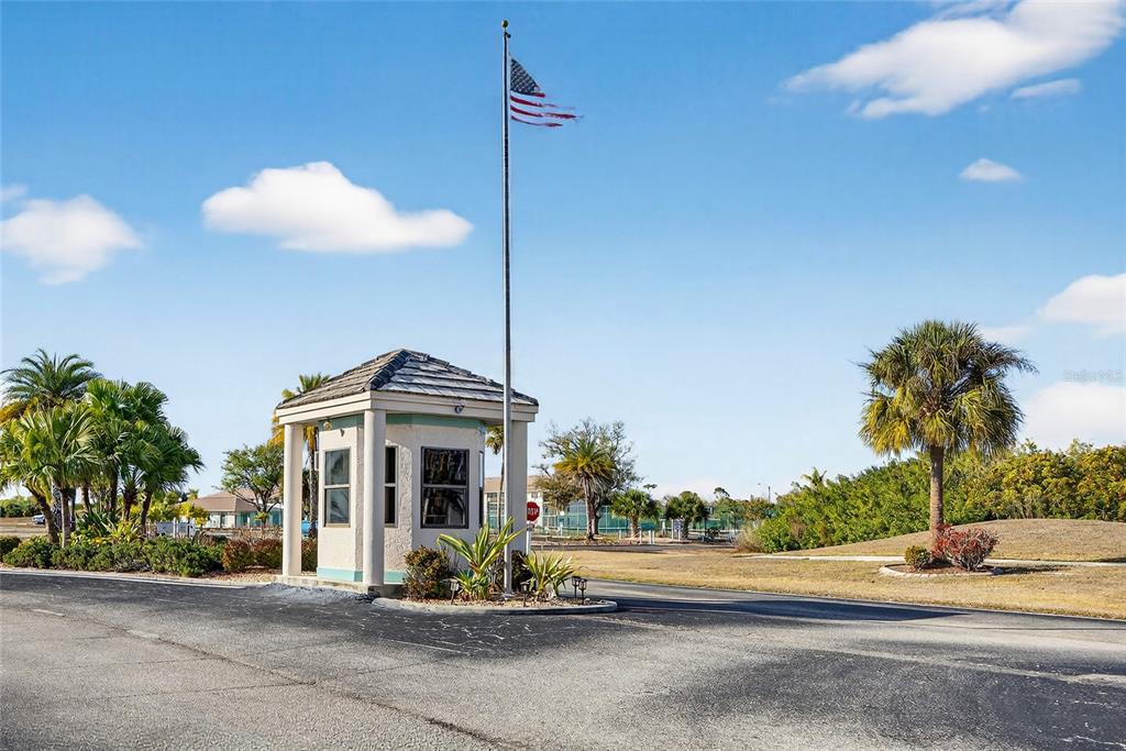 175 Kings Highway, Unit 738 Punta Gorda, FL 33983 - Photo 35 of 36 a front view of a house with a yard and potted plants