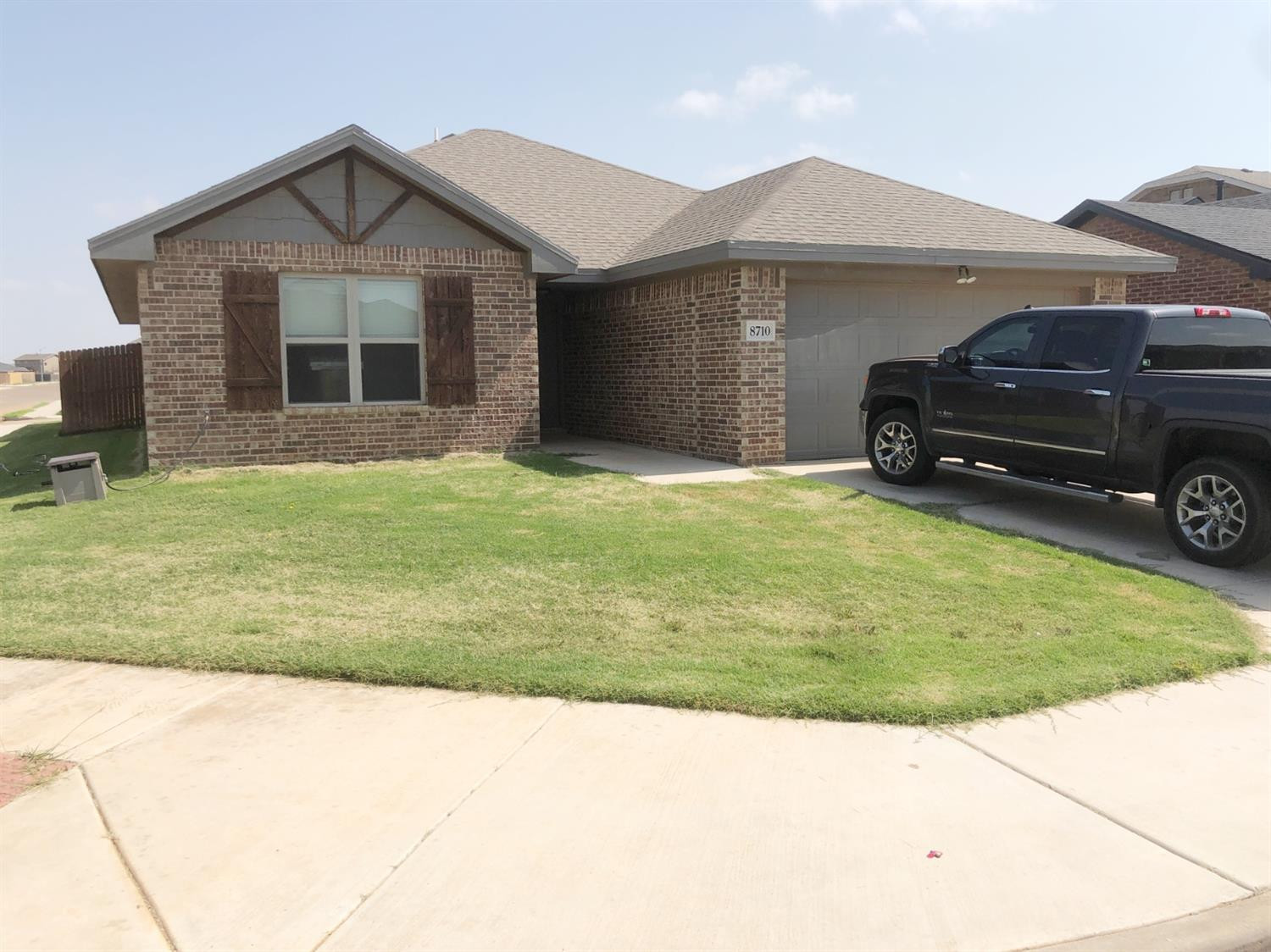 8710 12th Street Lubbock, TX 79416 - Photo 1 of 1 a front view of a house with a garden