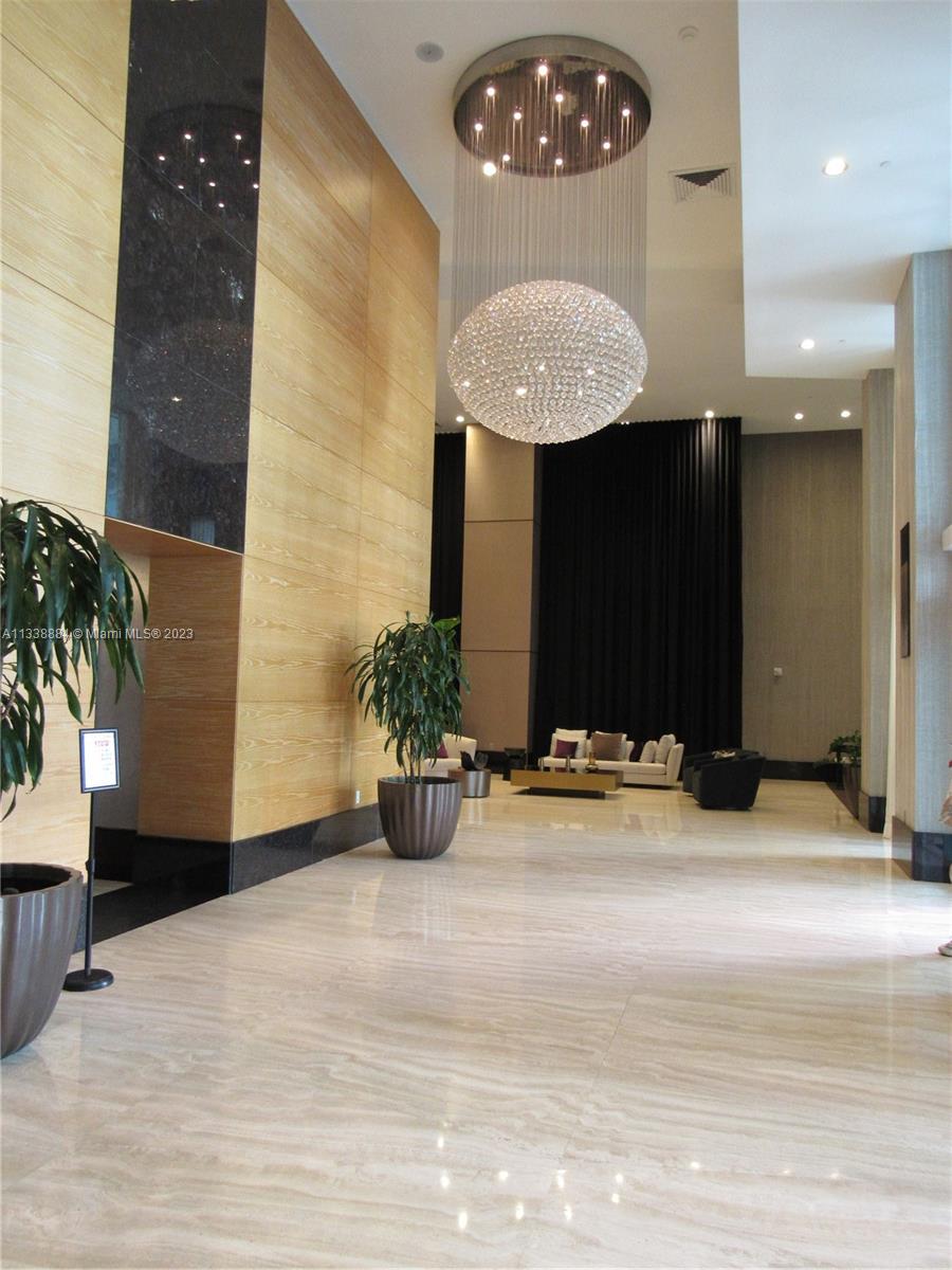 Plaza on Brickell Miami, FL 33131 - Photo 15 of 31 a view of a lobby a mirror and a potted plant