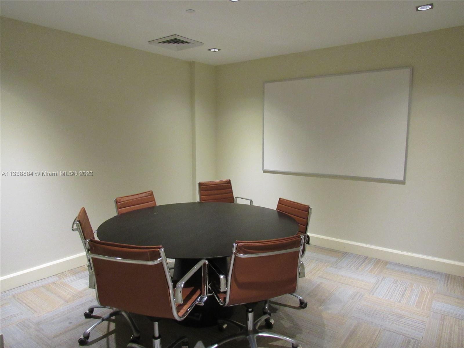 Plaza on Brickell Miami, FL 33131 - Photo 19 of 31 a living room with furniture and a table