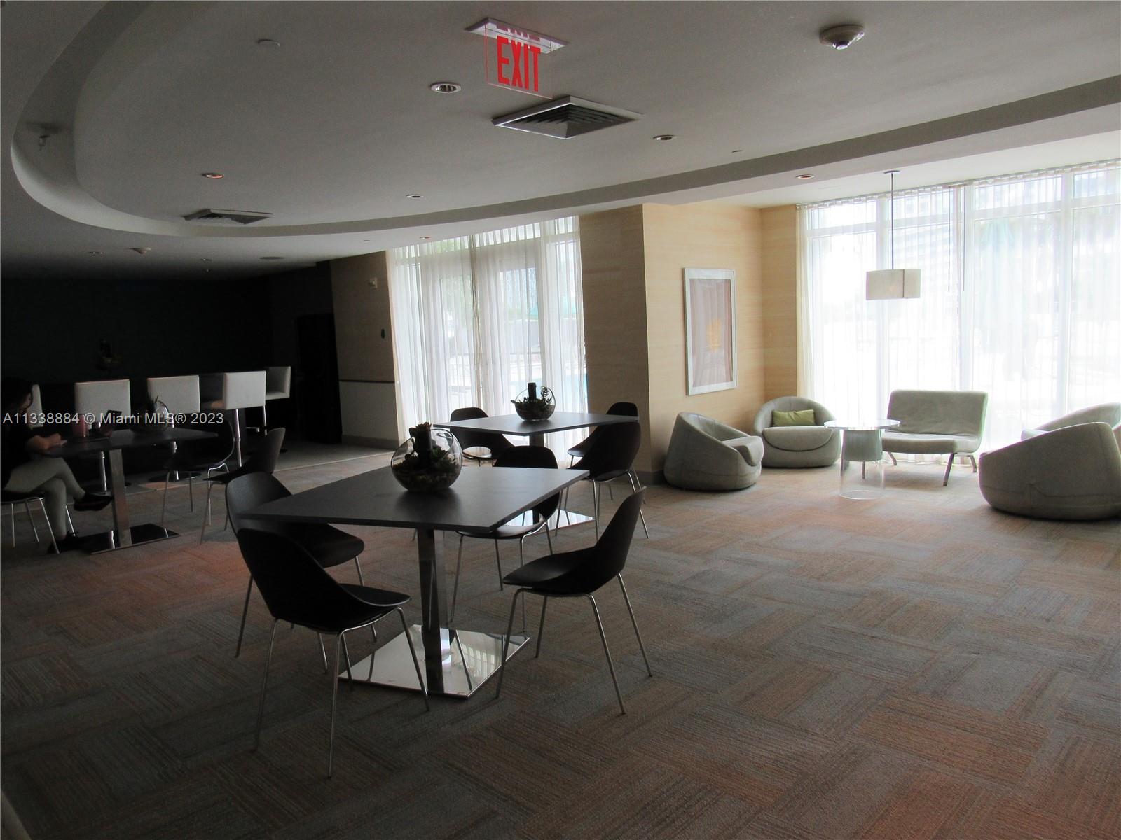 Plaza on Brickell Miami, FL 33131 - Photo 22 of 31 a living room with furniture and a large window