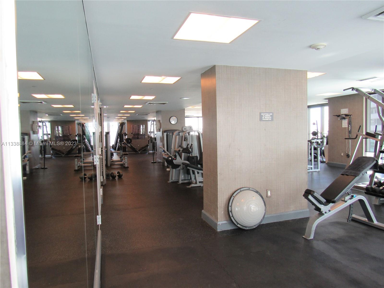 Plaza on Brickell Miami, FL 33131 - Photo 24 of 31 a room with lots of chairs and chandelier