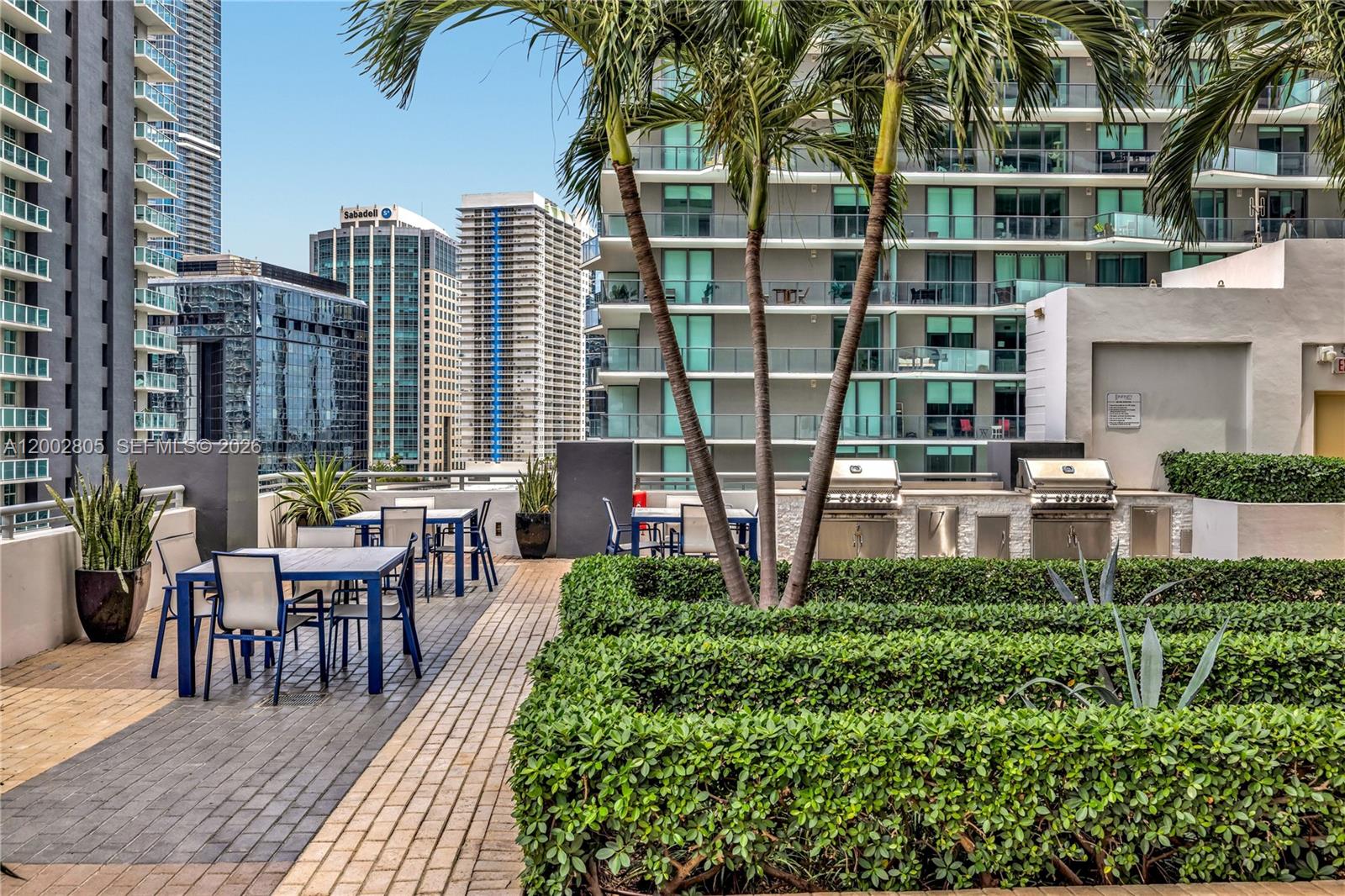 60 Southwest 13th Street, Unit 1124 Miami, FL 33130 - Photo 24 of 30 a view of a patio with couches table and chairs and potted plants