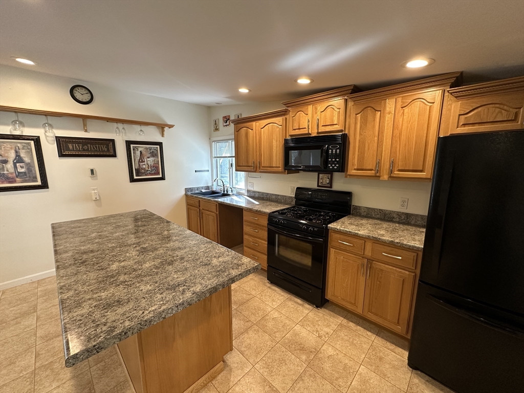 4 Highland Avenue Harvard, MA 01451 - Photo 11 of 29 a kitchen with stainless steel appliances granite countertop refrigerator stove top oven and sink