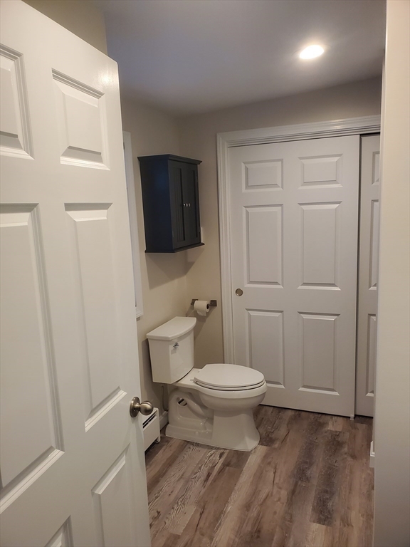 4 Highland Avenue Harvard, MA 01451 - Photo 17 of 29 a bathroom with a toilet a sink a vanity and mirror