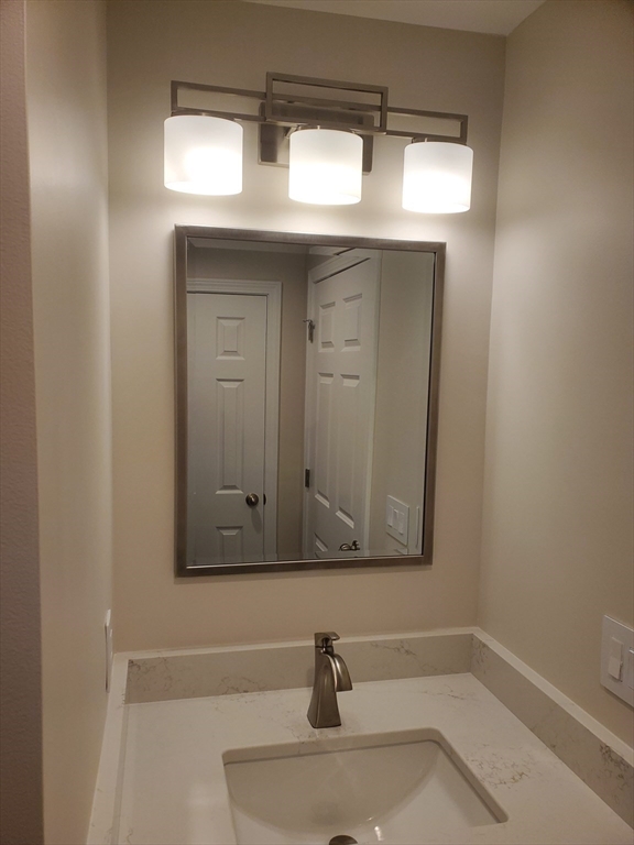 4 Highland Avenue Harvard, MA 01451 - Photo 20 of 29 a bathroom with a sink and a mirror