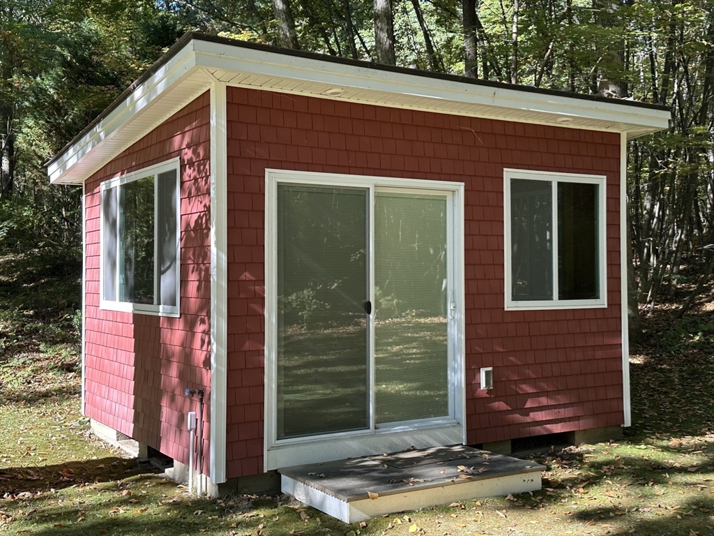4 Highland Avenue Harvard, MA 01451 - Photo 23 of 29 a front view of a house with garden