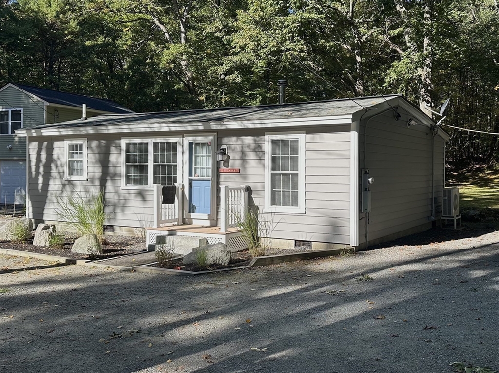4 Highland Avenue Harvard, MA 01451 - Photo 3 of 29 a front view of a house with a yard