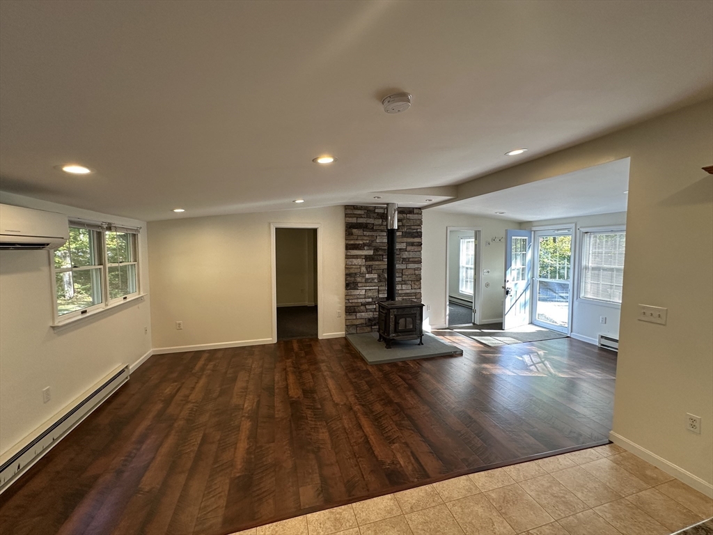 4 Highland Avenue Harvard, MA 01451 - Photo 7 of 29 a view of an empty room with wooden floor and a window