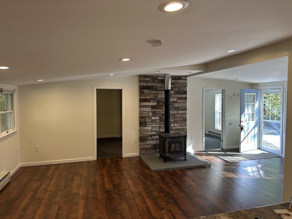 4 Highland Avenue Harvard, MA 01451 - Photo 8 of 29 an empty room with wooden floor and entrance to ceiling window