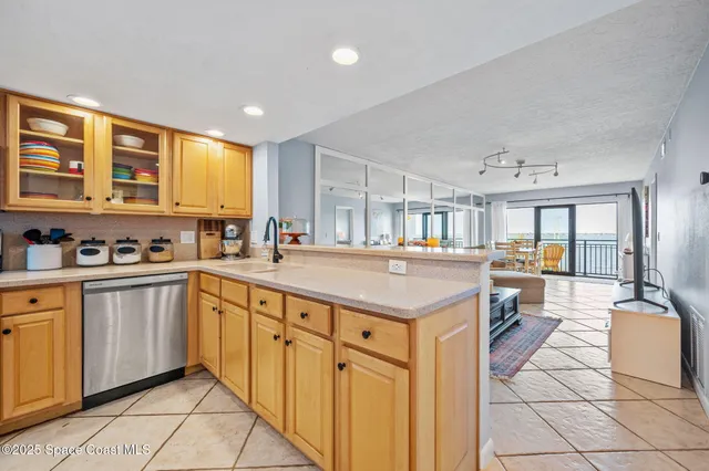 a living room with furniture a ceiling fan and a rug