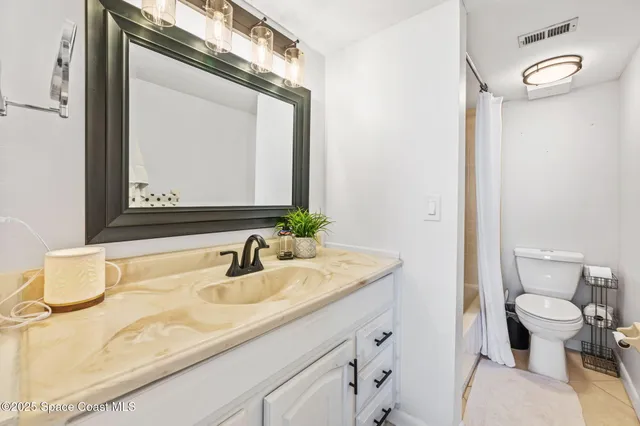 a view of walk in closet with clothes