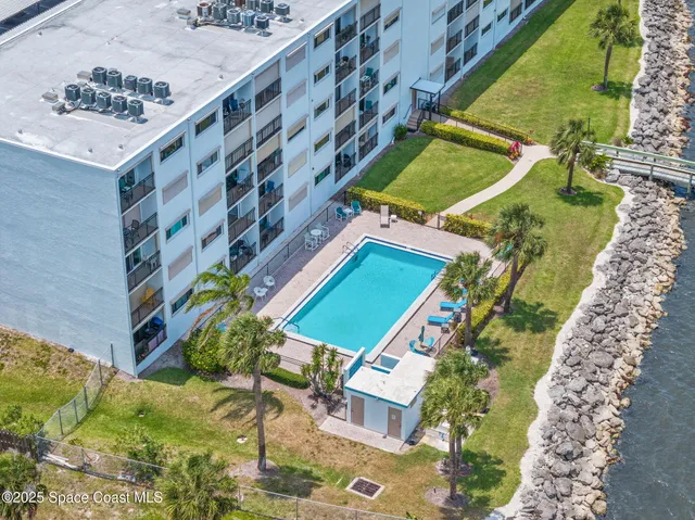 a view of a yard with an ocean view