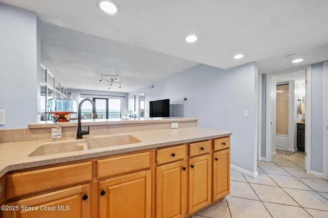 a kitchen with stainless steel appliances granite countertop a sink and cabinets