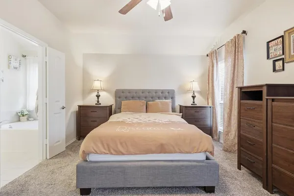 a bedroom with a bed and cupboard