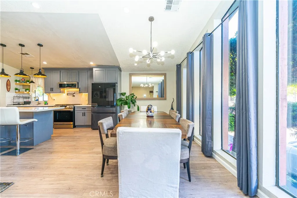 a view of a kitchen and dining room