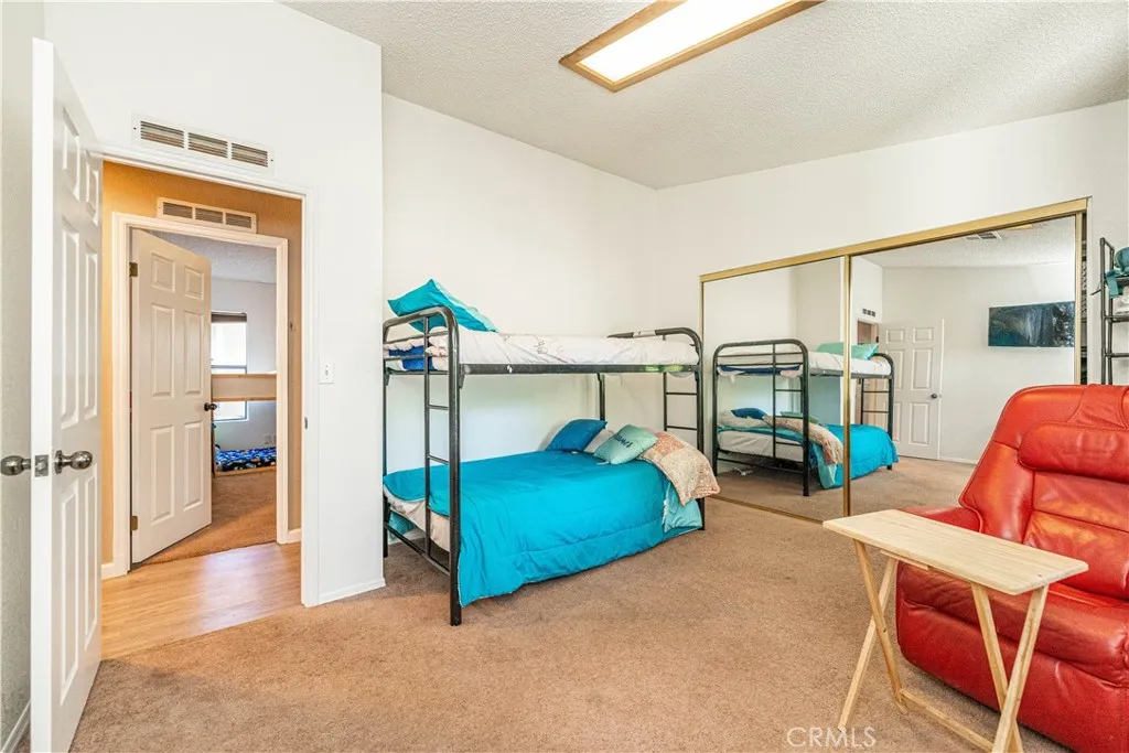 9080 Bloomfield Avenue, Unit 191 Cypress, CA 90630 - Photo 11 of 22 a bedroom with furniture and a view of bedroom