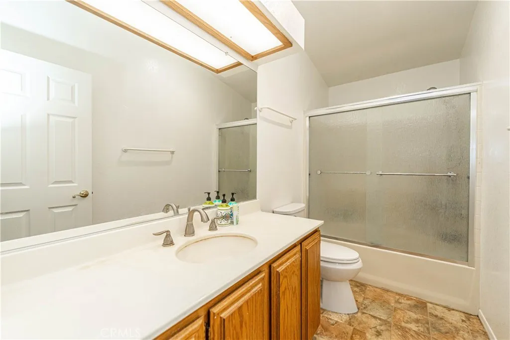 9080 Bloomfield Avenue, Unit 191 Cypress, CA 90630 - Photo 12 of 22 a bathroom with a sink toilet and shower