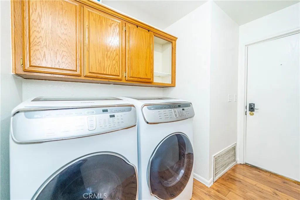 9080 Bloomfield Avenue, Unit 191 Cypress, CA 90630 - Photo 13 of 22 a utility room with dryer and washer