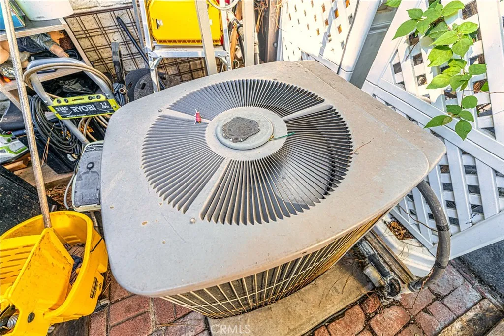 9080 Bloomfield Avenue, Unit 191 Cypress, CA 90630 - Photo 18 of 22 a view of a swimming pool with a patio and a garden