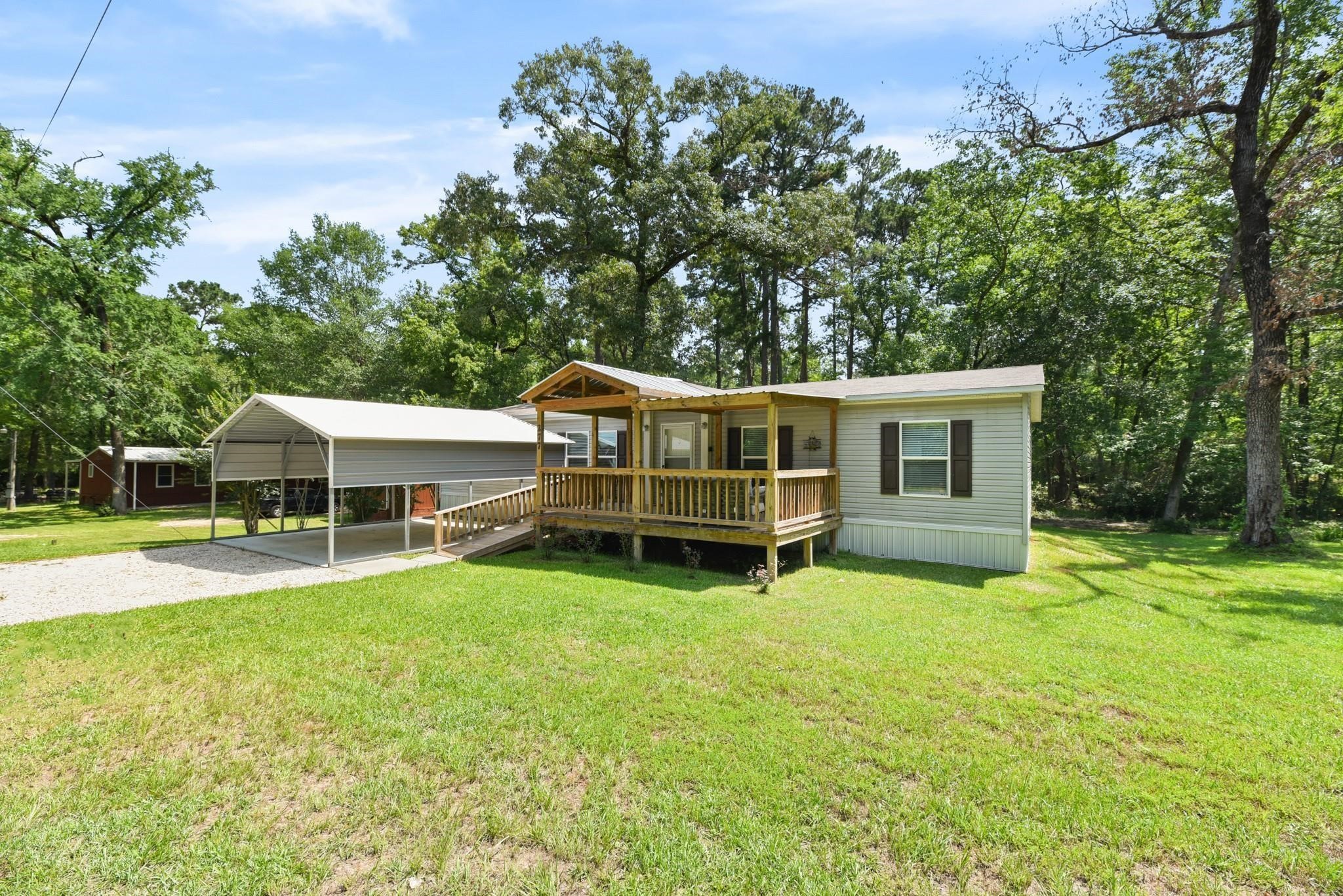 277 Rio Grande Drive Trinity, TX 75862 - Photo 27 of 50 a view of a house with a yard and sitting area
