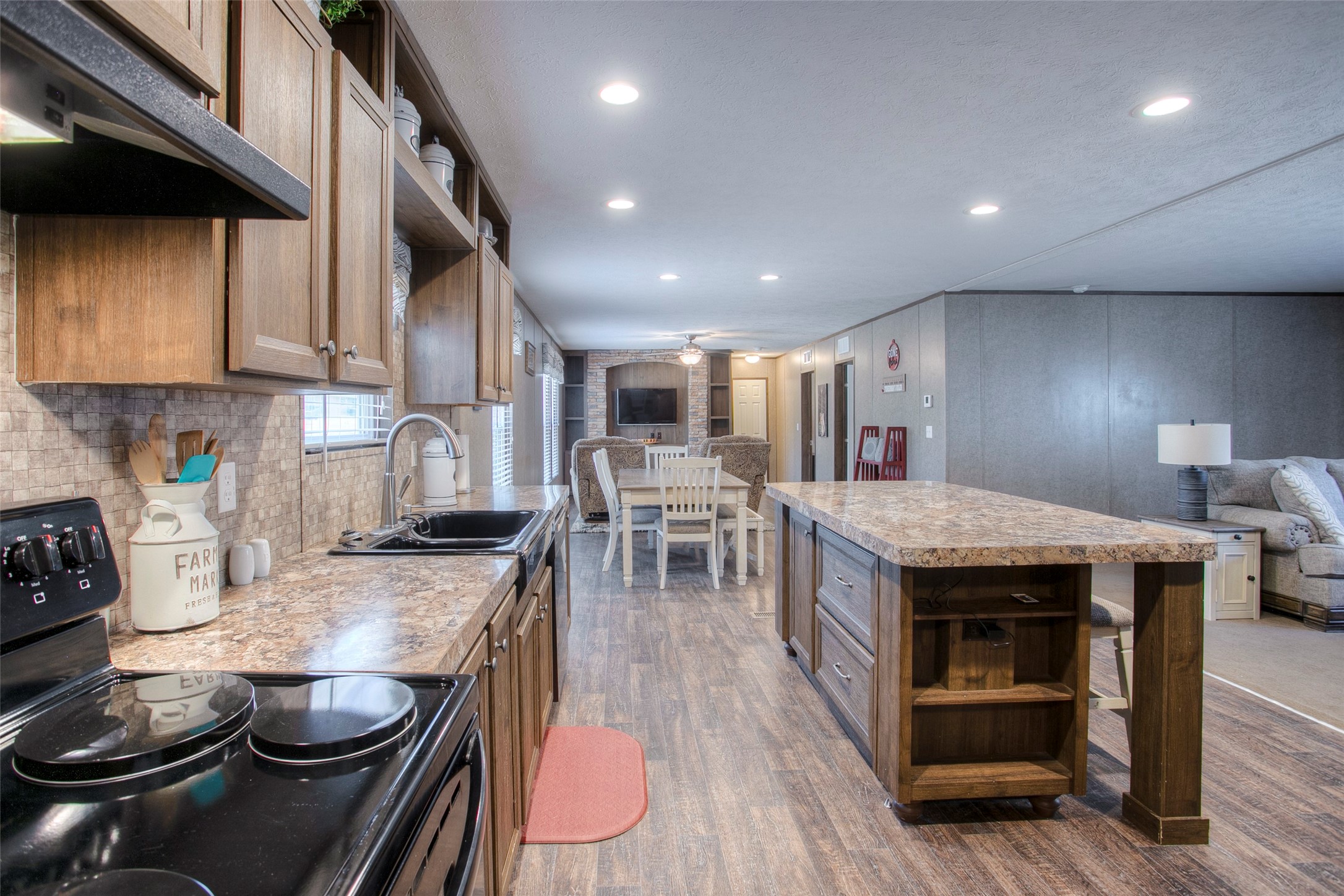 277 Rio Grande Drive Trinity, TX 75862 - Photo 4 of 50 a kitchen with stainless steel appliances granite countertop a stove and a wooden floors