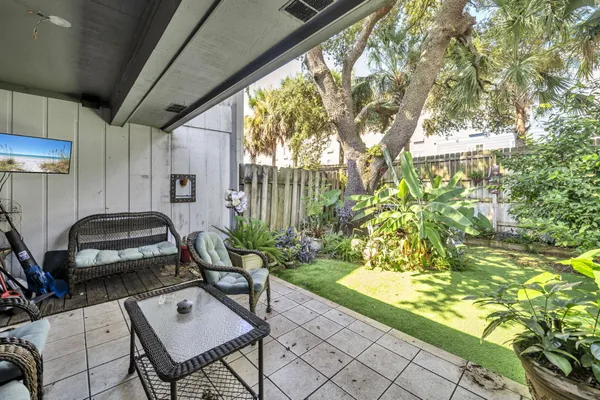 a living room with patio furniture