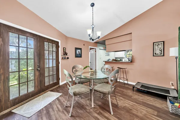 a dining room with furniture and window