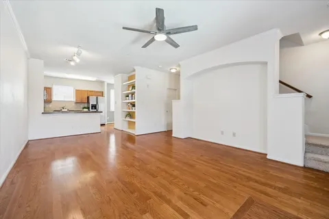 a kitchen with stainless steel appliances granite countertop a sink a stove and cabinets