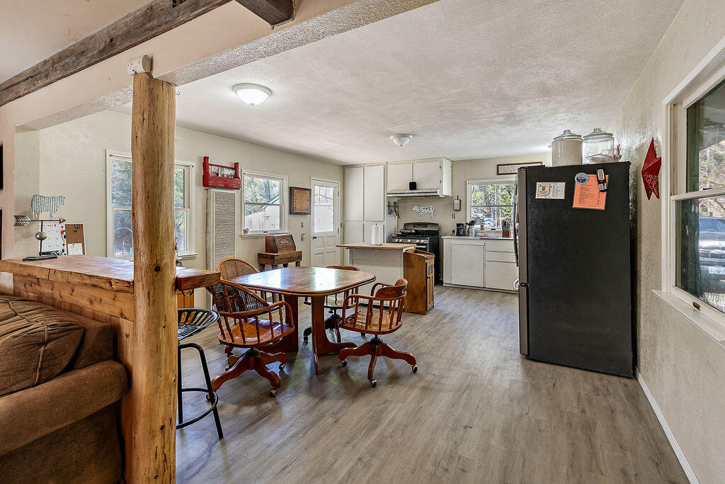4832 Anderson Creek Road Talent, OR 97540 - Photo 28 of 39 a dining room with furniture and wooden floor