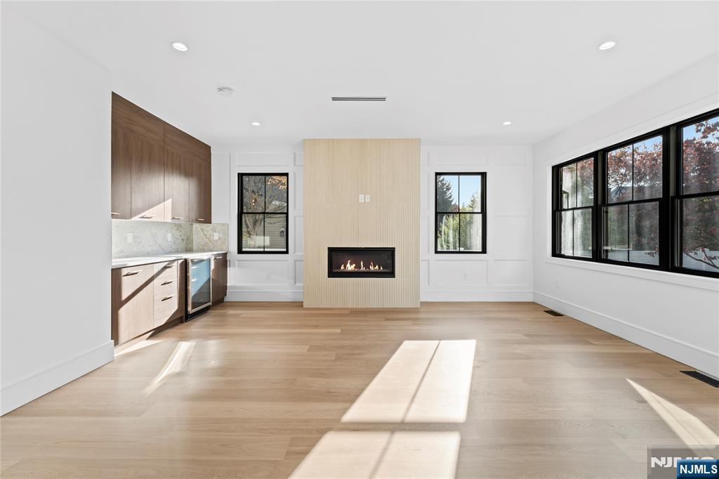 215 Kensington Road River Edge, NJ 07661 - Photo 11 of 37 a view of an empty room with window and cabinet