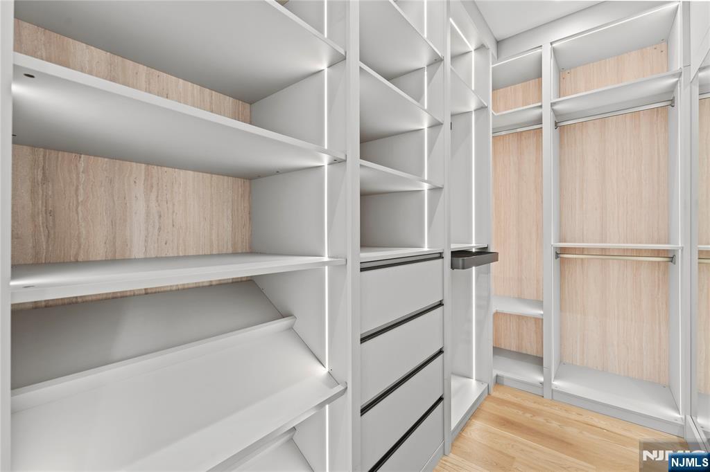 215 Kensington Road River Edge, NJ 07661 - Photo 20 of 37 a view of walk in closet with empty racks
