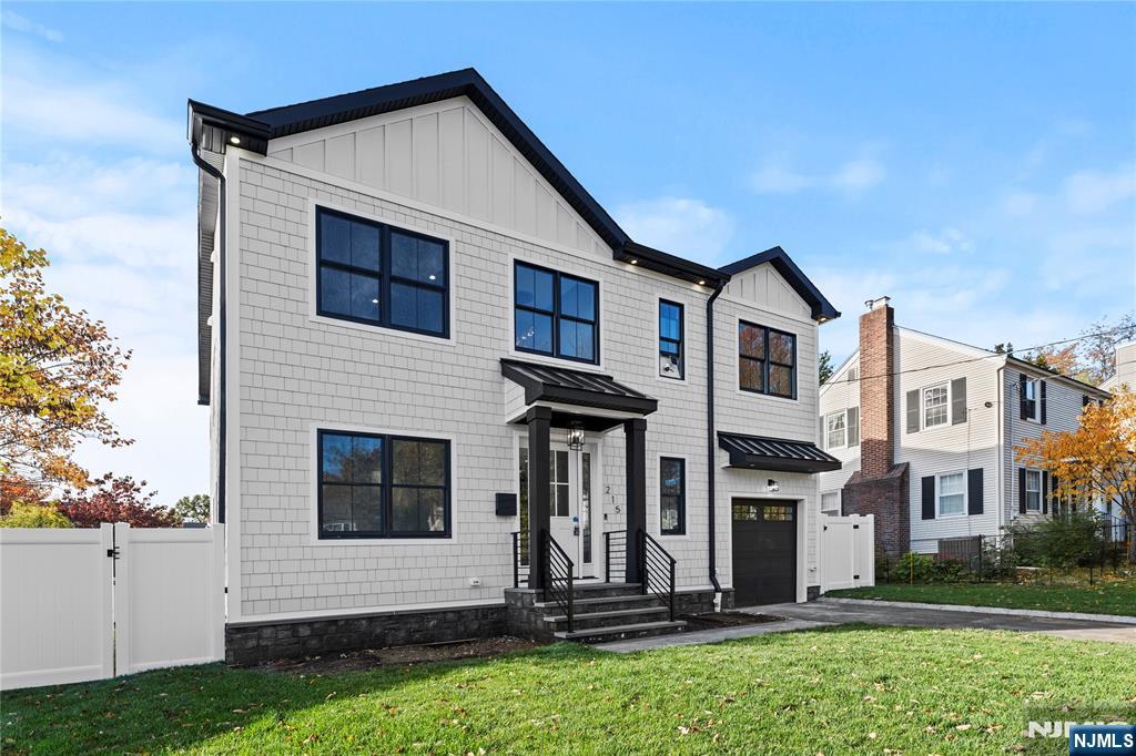 215 Kensington Road River Edge, NJ 07661 - Photo 2 of 37 a front view of a house with a yard