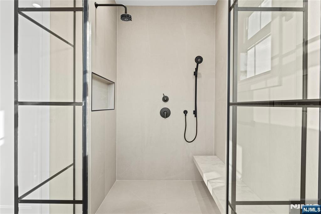 215 Kensington Road River Edge, NJ 07661 - Photo 24 of 37 a bathroom with a glass shower door