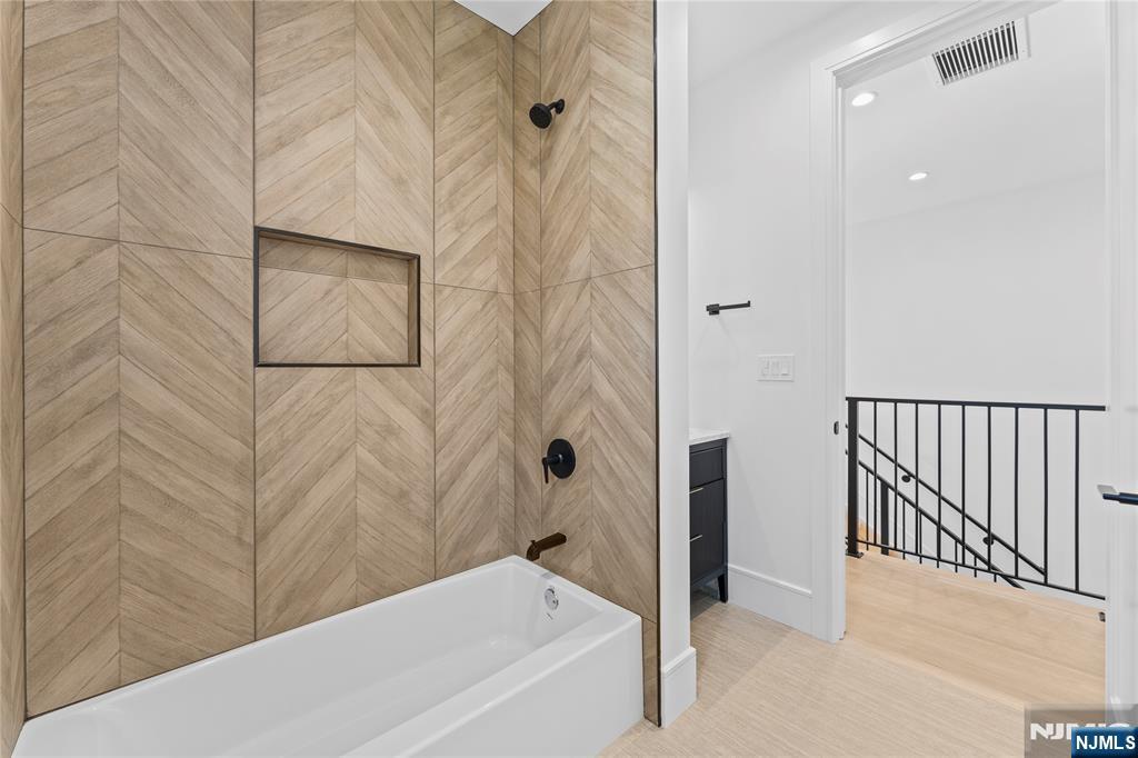 215 Kensington Road River Edge, NJ 07661 - Photo 29 of 37 a bathroom with a bathtub and shower