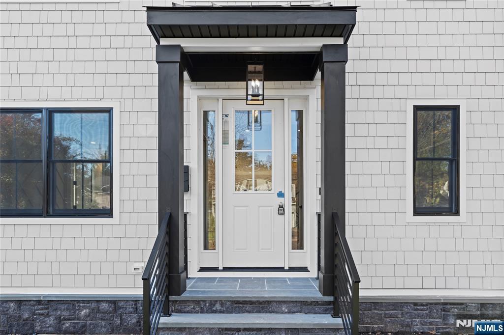 215 Kensington Road River Edge, NJ 07661 - Photo 3 of 37 a front view of a house with a window