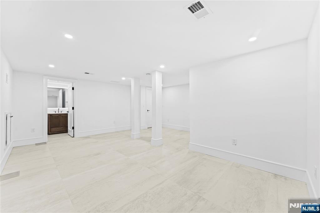 215 Kensington Road River Edge, NJ 07661 - Photo 33 of 37 an empty room with kitchen appliances and windows