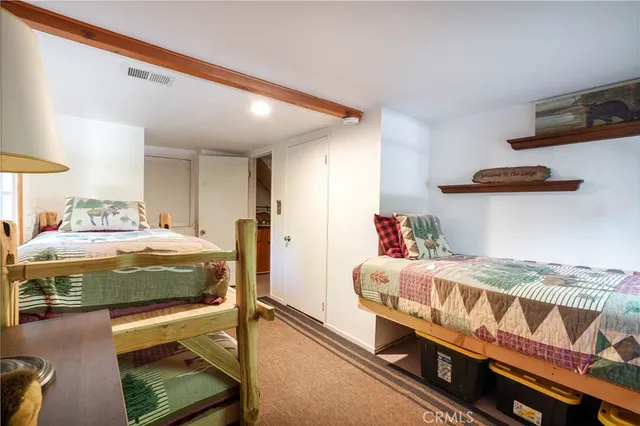 a bedroom with a bed and stairs