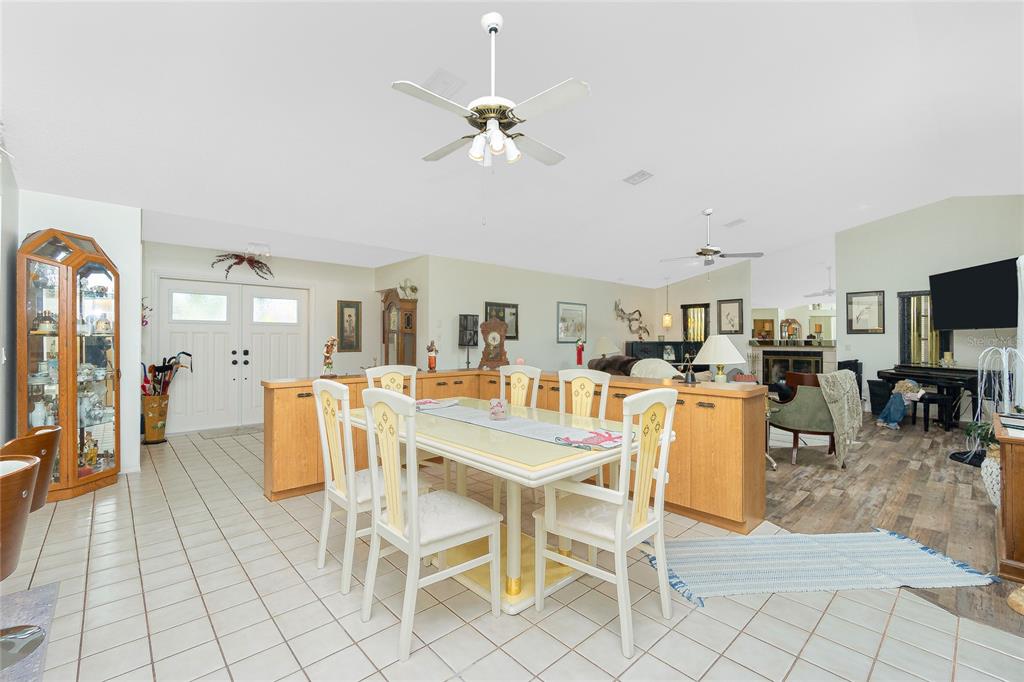 204 Bunker Road Rotonda West, FL 33947 - Photo 15 of 49 a dining room with furniture and chandelier